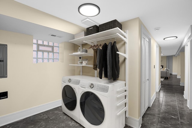 clothes washing area with separate washer and dryer