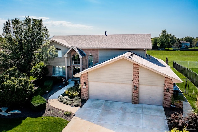 front of property with a front yard and a garage