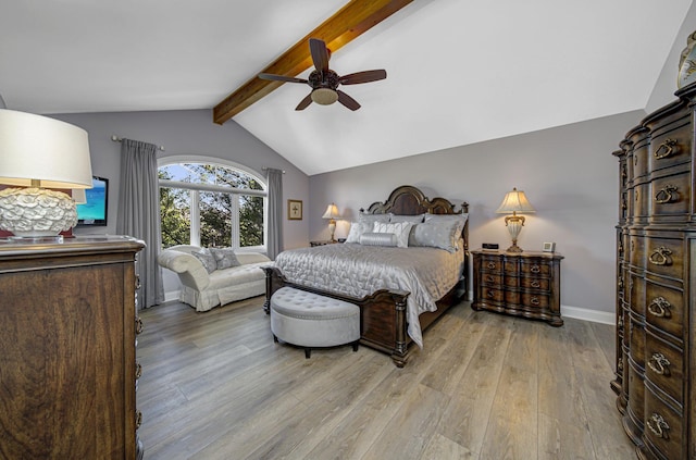 bedroom with ceiling fan, lofted ceiling with beams, and light hardwood / wood-style floors