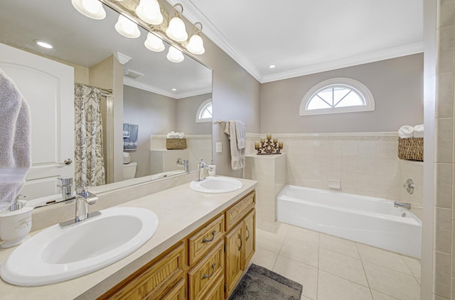 bathroom with a washtub, crown molding, tile walls, tile patterned flooring, and toilet