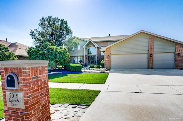 view of front of property featuring a garage and a front yard