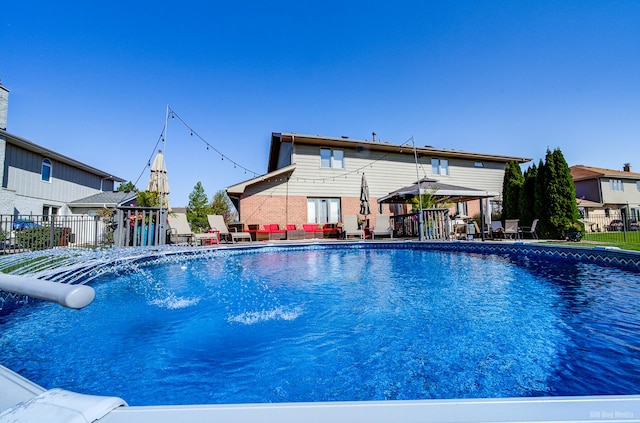 view of swimming pool featuring a gazebo