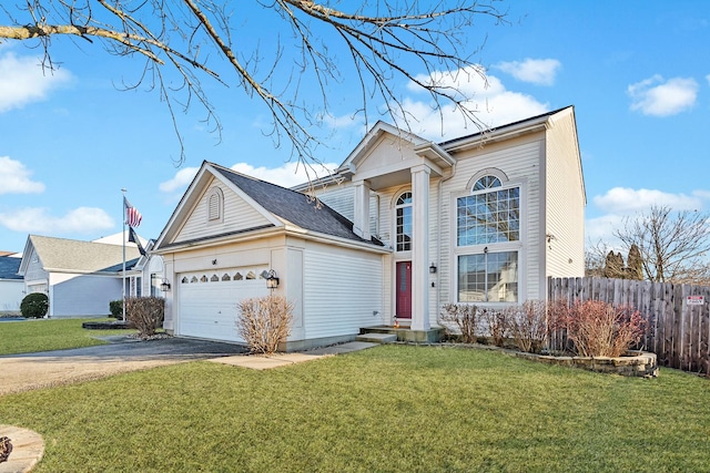 view of front property featuring a garage and a front yard