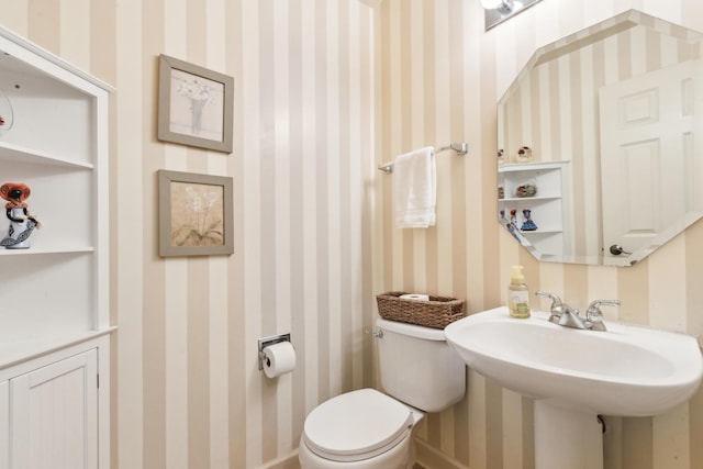 bathroom featuring toilet and sink