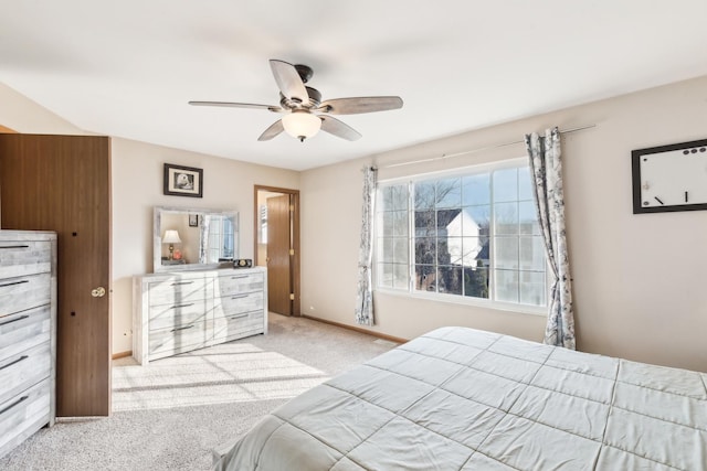 bedroom with ceiling fan and light colored carpet