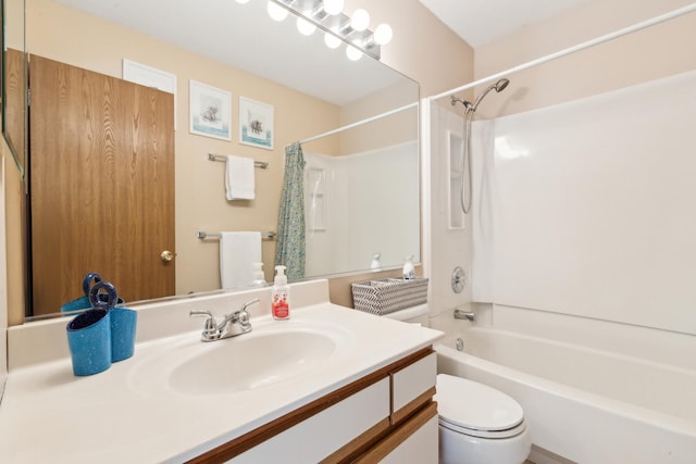 full bathroom with vanity, shower / bath combo, and toilet