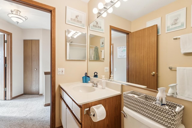 bathroom featuring vanity and toilet