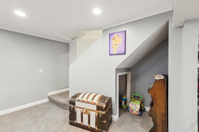 sitting room featuring light colored carpet