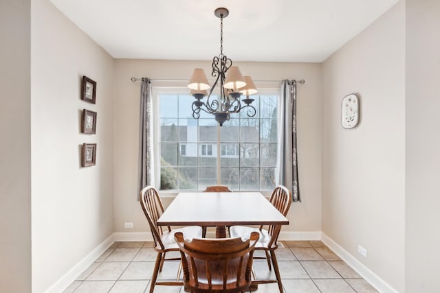 dining space featuring a chandelier and light tile patterned floors