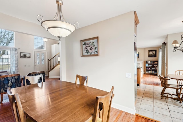 dining area with light hardwood / wood-style floors