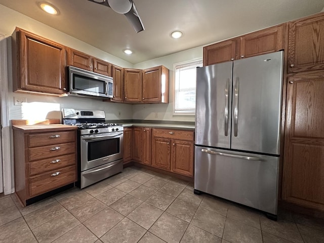 kitchen featuring tile patterned flooring and appliances with stainless steel finishes