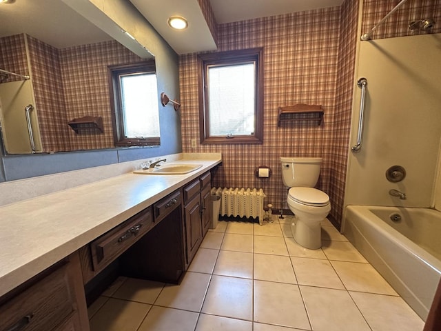 full bathroom with vanity, bathtub / shower combination, tile patterned floors, toilet, and radiator heating unit