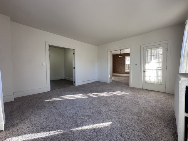 interior space with dark colored carpet