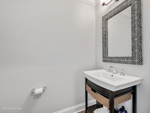 bathroom featuring crown molding and vanity