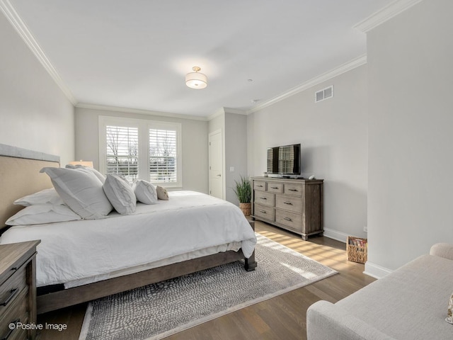 bedroom with light hardwood / wood-style flooring and ornamental molding