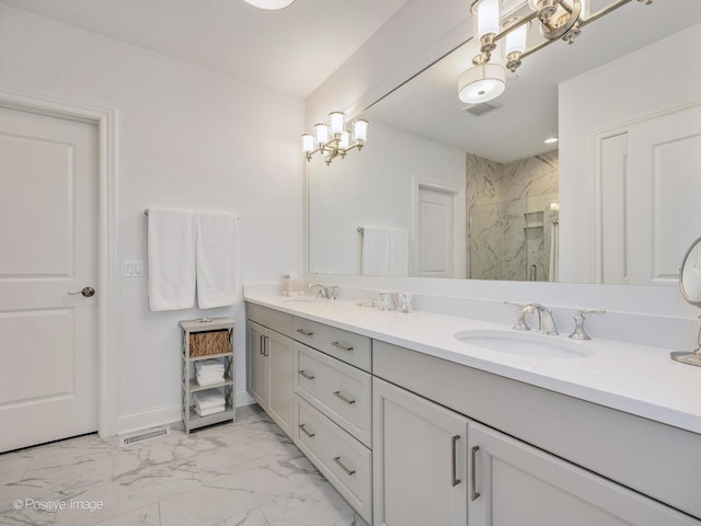 bathroom featuring vanity and an enclosed shower