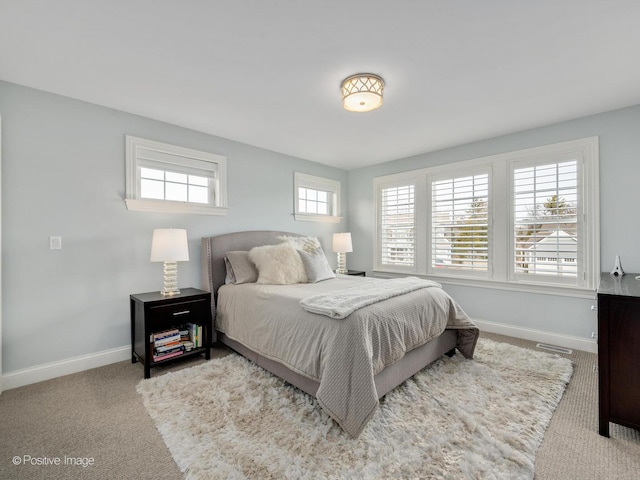 bedroom with light colored carpet