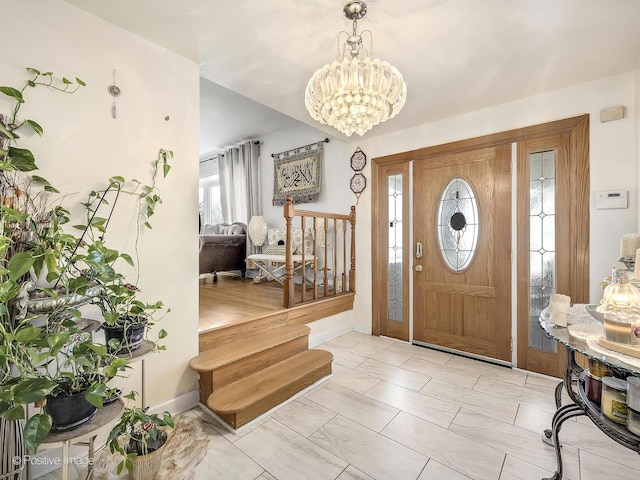 entrance foyer featuring a notable chandelier