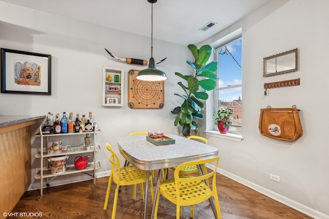 dining room featuring dark hardwood / wood-style floors