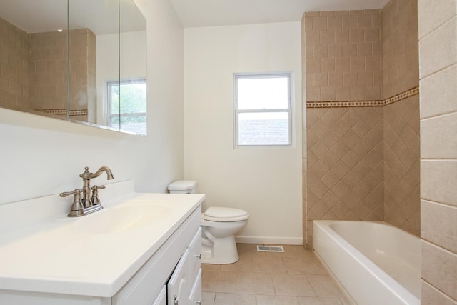 full bathroom with toilet, vanity, tile patterned floors, and a healthy amount of sunlight