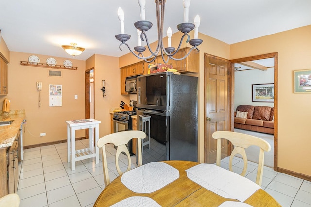 dining room with light tile patterned flooring and a chandelier