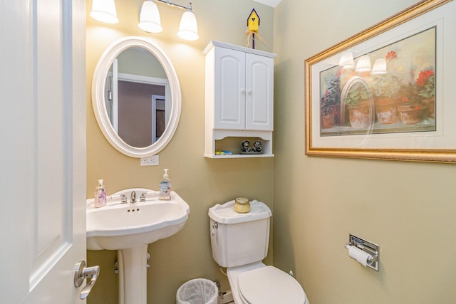 bathroom featuring toilet and sink