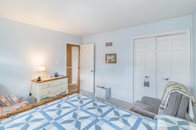 carpeted bedroom featuring a closet