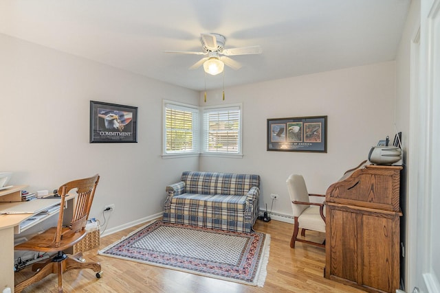 office space featuring light hardwood / wood-style floors and ceiling fan