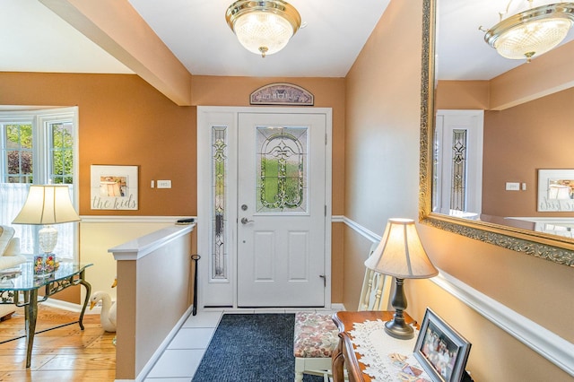 foyer entrance with light tile patterned floors