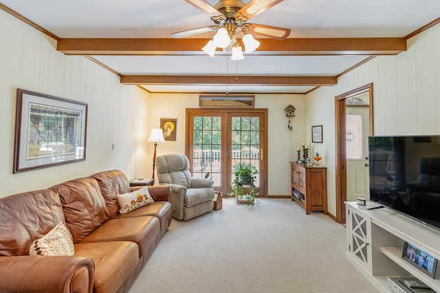 carpeted living room featuring beam ceiling and ceiling fan