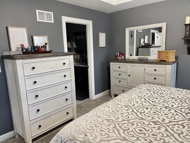 bedroom with light colored carpet