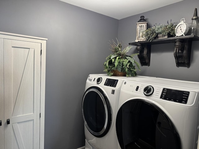 washroom featuring independent washer and dryer