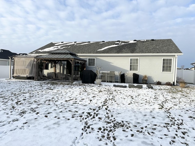 snow covered property featuring a gazebo