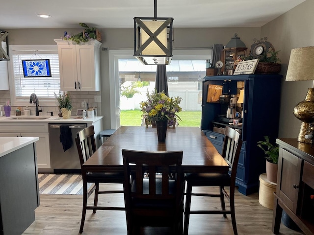 dining area featuring light hardwood / wood-style floors and sink