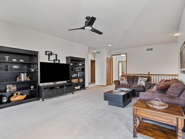 carpeted living room featuring ceiling fan