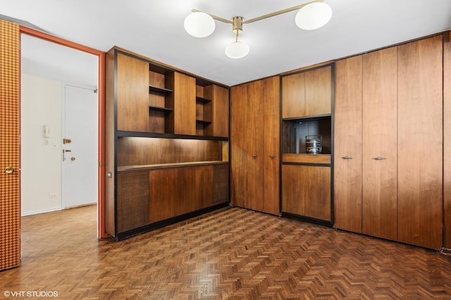 interior space with dark parquet flooring