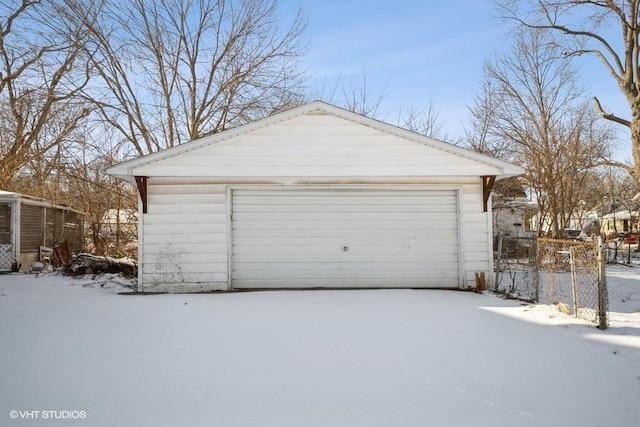 view of snow covered garage