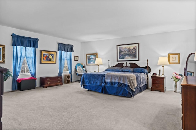 bedroom featuring light colored carpet