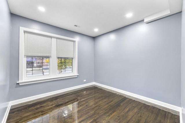 unfurnished room featuring dark hardwood / wood-style floors