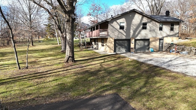 view of property exterior featuring a deck, a yard, and a garage