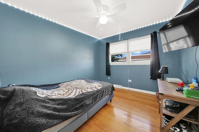 bedroom featuring hardwood / wood-style floors and ceiling fan