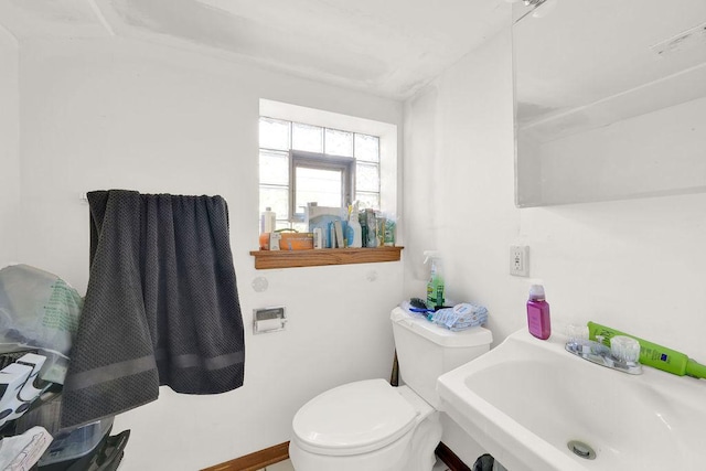 bathroom featuring sink and toilet