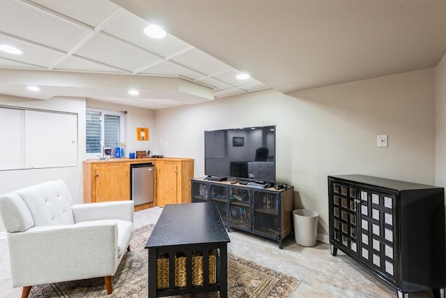 living area with recessed lighting and unfinished concrete flooring