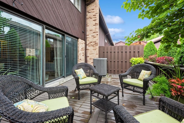 deck with central air condition unit and fence