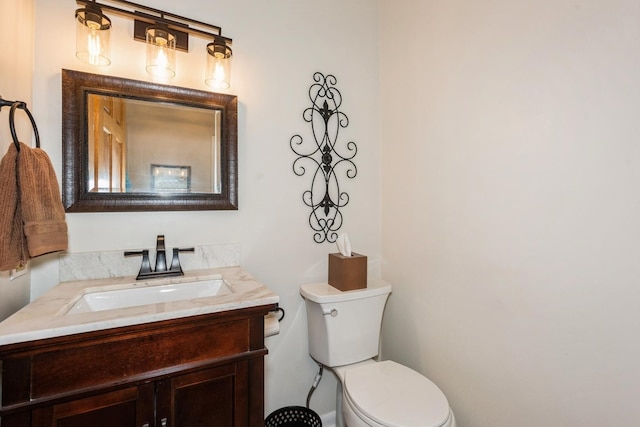 half bath with vanity and toilet