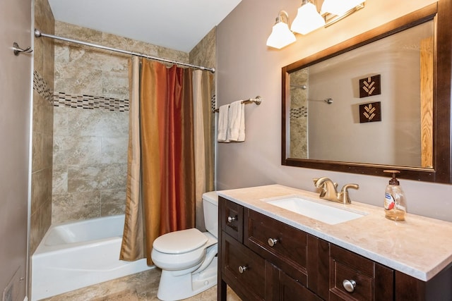 bathroom featuring toilet, shower / bath combo, and vanity