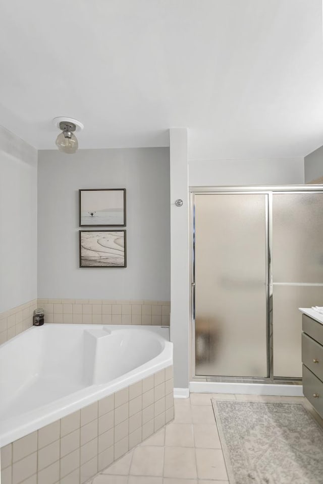 bathroom with vanity, tile patterned floors, and separate shower and tub