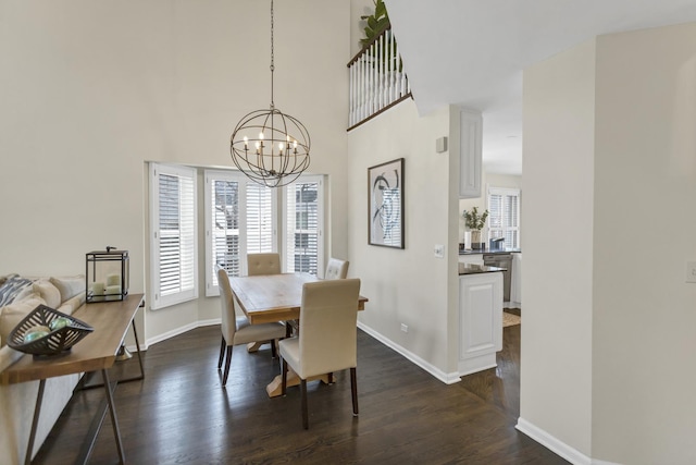 dining space featuring a notable chandelier and dark hardwood / wood-style flooring