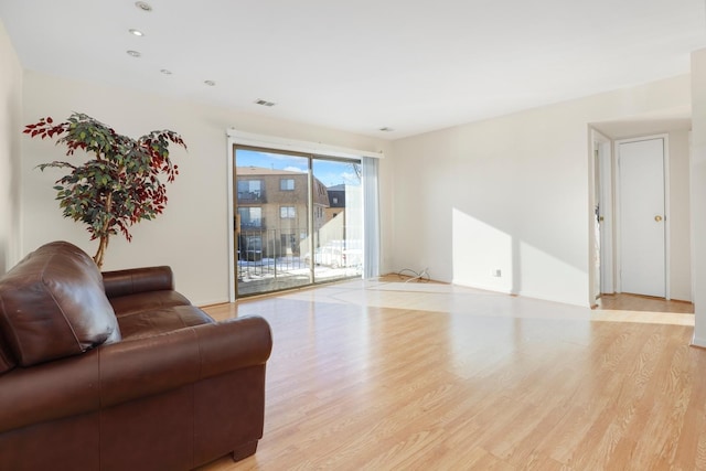 living room with light hardwood / wood-style flooring