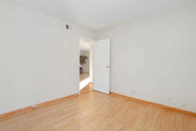 unfurnished room featuring hardwood / wood-style floors